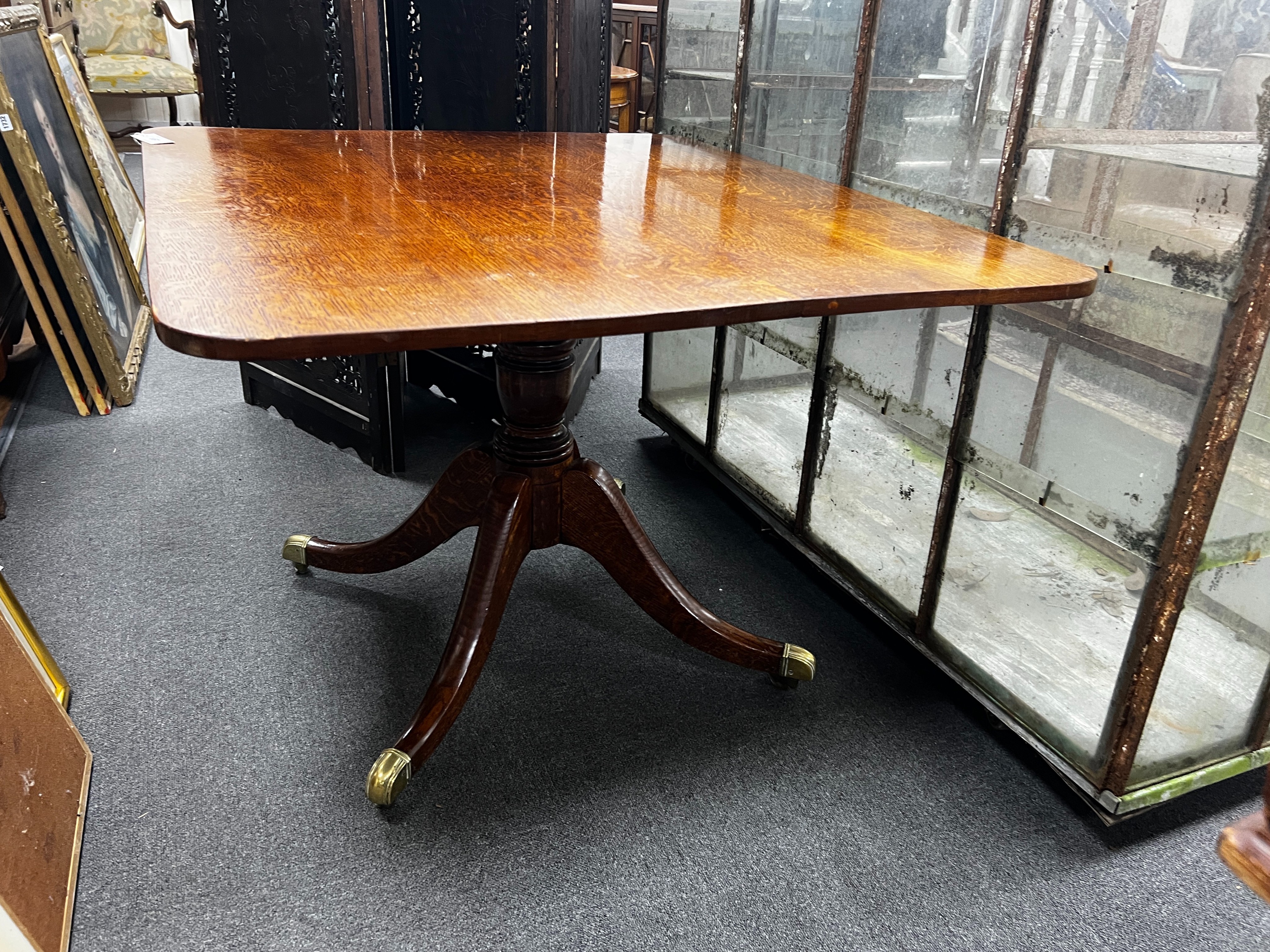 A Regency rectangular oak tilt top dining table, length 110cm, width 94cm, height 72cm